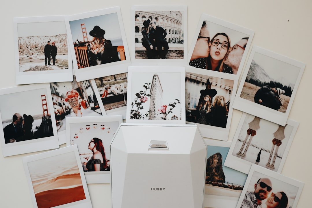 A wall of photographs representing collectible photo card sets and variations