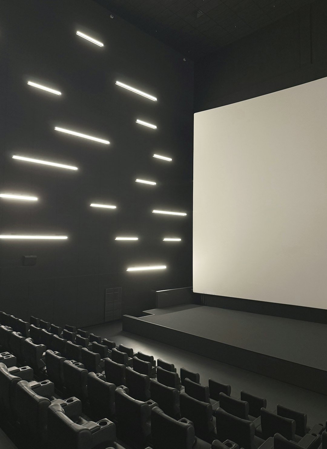 Modern cinema auditorium with a large screen, illustrating K-pop concert cinema distribution