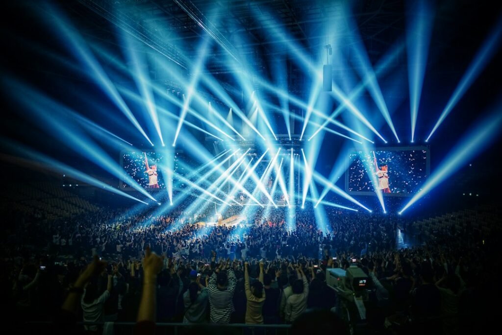 Performers on a concert stage under blue lights, used as an illustrative image for 82MAJOR's first music show win