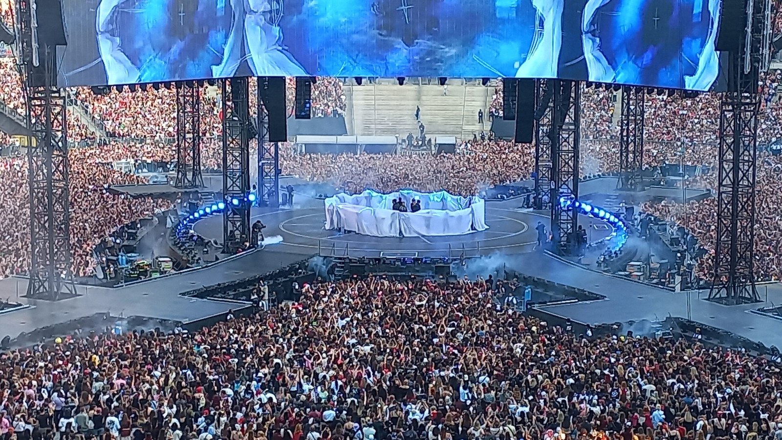 BTS performing SWIM onstage during their ARIRANG World Tour concert in Paris on July 17, 2026
